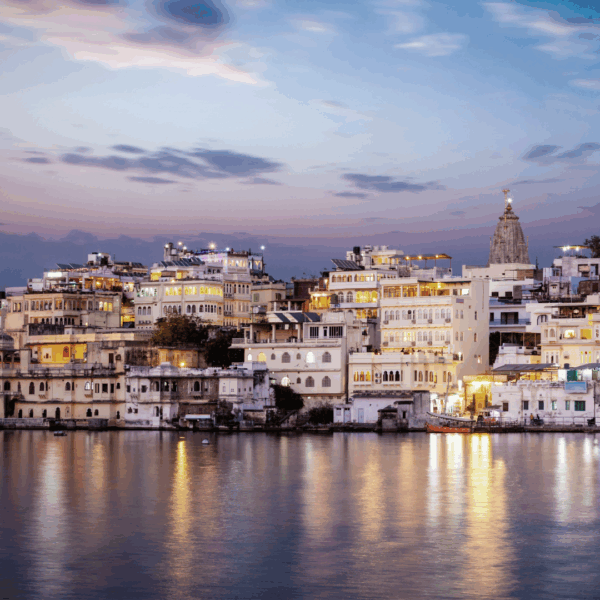 Evening view of Udaipur’s illuminated lakeside architecture, representing India’s evolving family office landscape and growing influence in wealth management