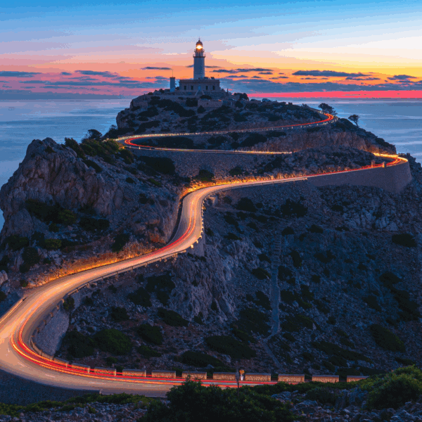 Winding coastal road leading to a lighthouse at sunset, symbolising direction and guidance for family offices Winding coastal road leading to a lighthouse at sunset, symbolising direction and guidance for family offices