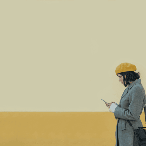 Woman using smartphone symbolising next-gen family office leaders embracing digital concierge solutions