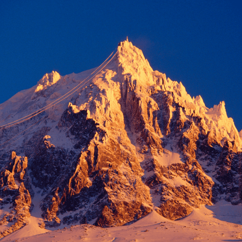 Snow-capped mountain at sunrise symbolising clarity and precision in family office due diligence
