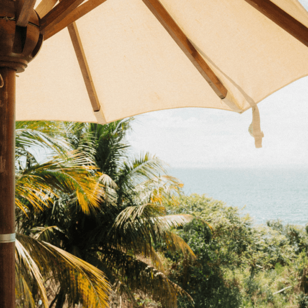 A luxury outdoor setting overlooking the ocean, representing discreet lifestyle support and digital concierge services for family offices.