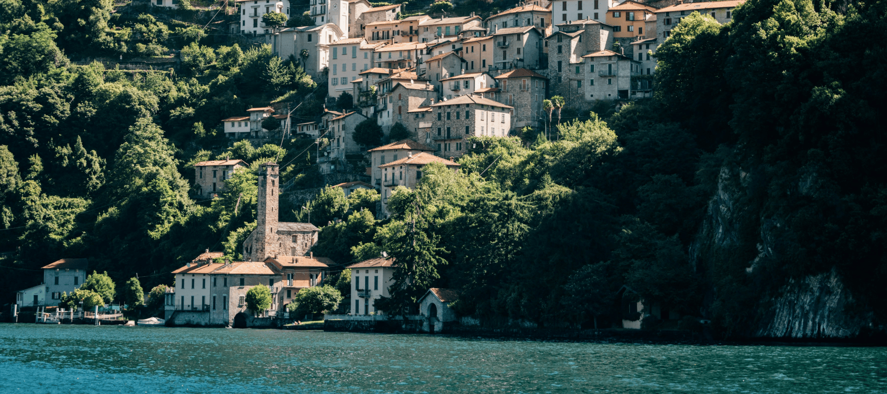 Italian lakeside village illustrating Italy as a destination for UHNWI and family offices