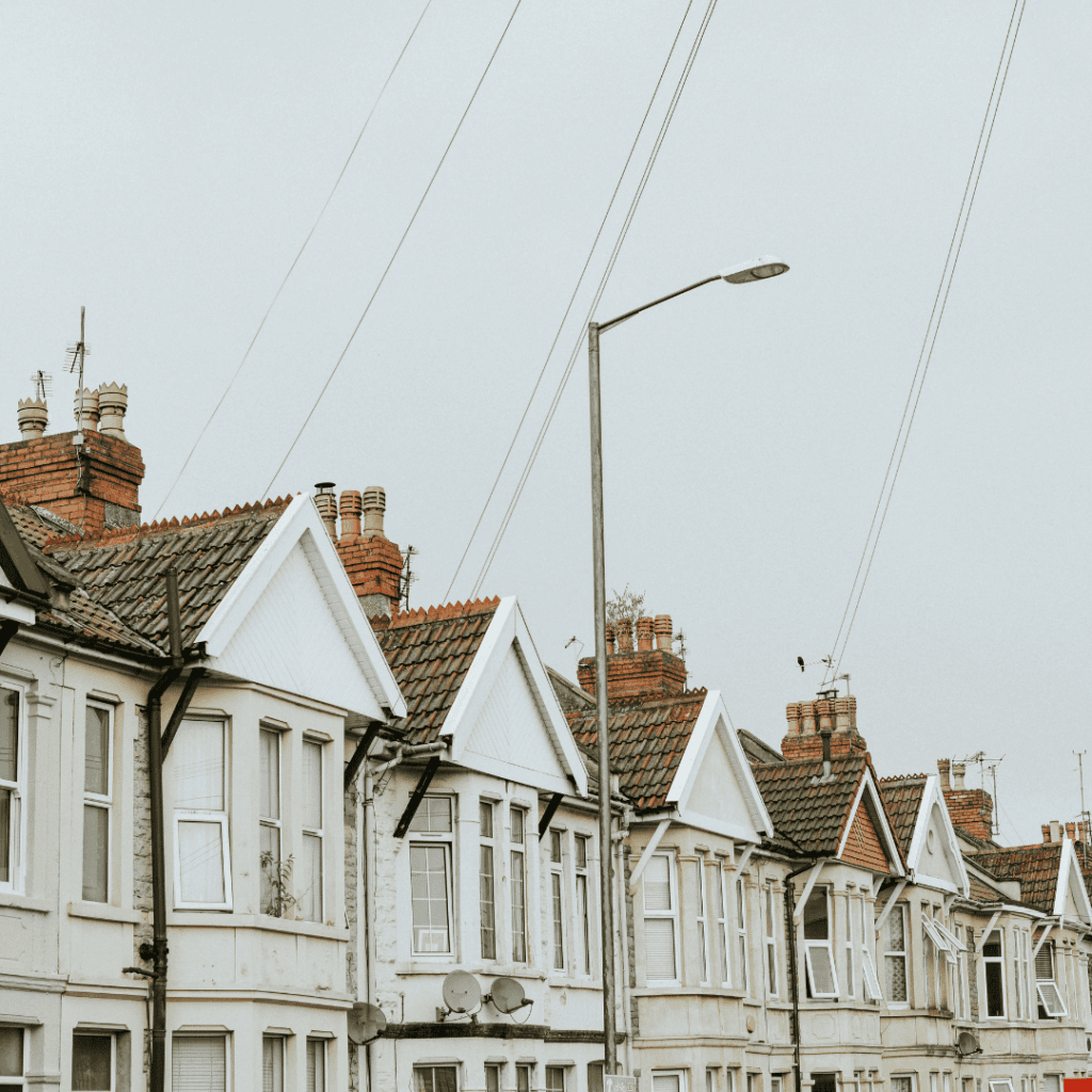 A row of traditional UK terraced houses representing multi-generational property inheritance and portfolio restructuring